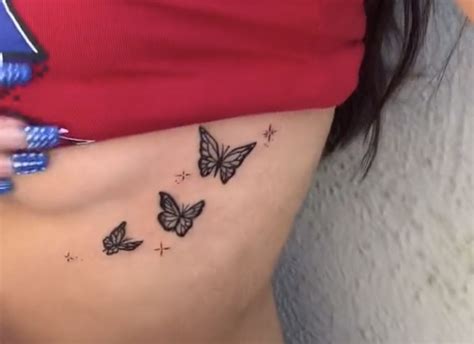 Butterfly underboob tattoo